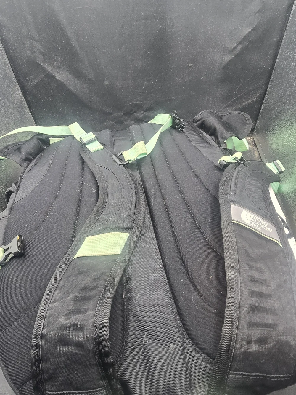 The North Face Black Backpack with Mint Green Bungee and Straps